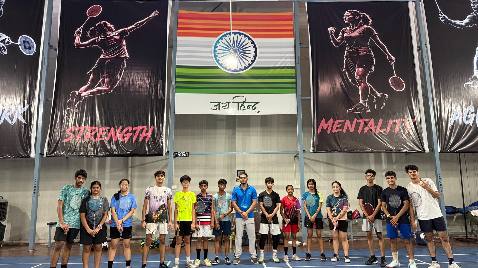 Infinity Smashers badminton students with their coach